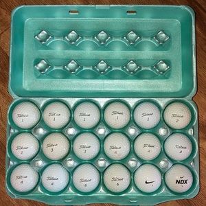 18 Used but useable Titleist and Nike Golfballs.